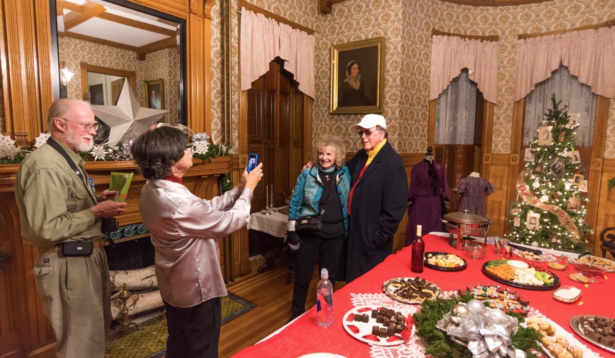 Karolyn Grimes and Jimmy Hawkins pose for photos at the Welcome Reception hosted by the Seneca Falls Historical Society.  Photo by Henry Law