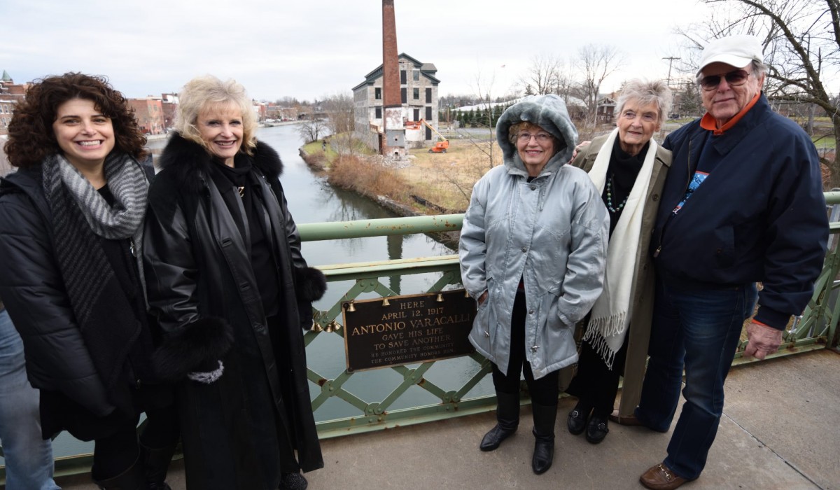 "Every time a bell rings . . . ":  (Left to right)  Monica Capra Hodges (Frank Capra's granddaughter), Karolyn Grimes (Zuzu Bailey), Carol Coombs (Janie Bailey), Jeanine Roose (Young Violet Bick) and Jimmy Hawkins (Tommy Bailey) attach bells to the bridge in honor of their loved ones. Call us at 315-568-5838 to place a bell on our bridge in honor of someone who has impacted your life ($20 donation). Photo by Henry Law