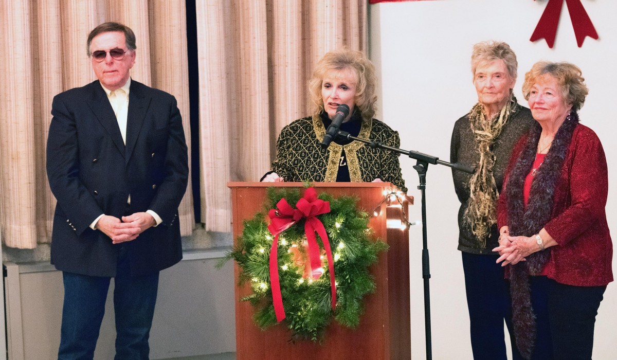 Karolyn Grimes at the podium with (left to right) Jimmy Hawkins, Jeanine Roose and Carol Coombs at "Frank Capra's Preview Dinner" held at the New York Chiropractic College.  Photo by Henry Law