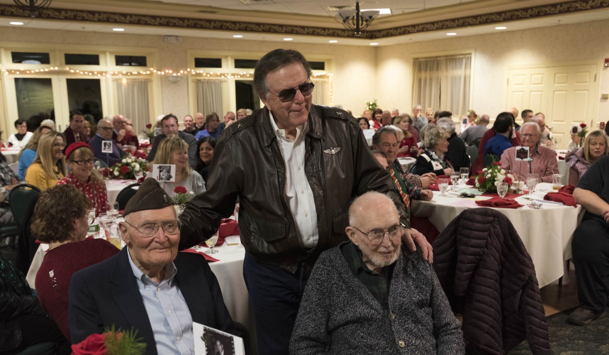 World War II Veterans Ed Chase and John Robbins are honored by Jimmy Hawkins (Tommy Bailey), other cast members and fans from around the country who attended the Sunday night dinner "Welcome Home, Harry Bailey -- Celebrating the Final Scene of 'It's a Wonderful Life.'" Photo by Henry Law