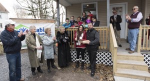 Actors from "It's a Wonderful Life" present "Bread, Salt & Wine" to Alicia and Jason Carnicelli and their nine children as part of a housewarming ceremony is association with Habitat for Humanity.  Menzo Case, President of the Board of Habitat for Humanity Seneca County, and Lou Ferrara, Construction Chair, can be seen to the right.  Photo by Henry Law